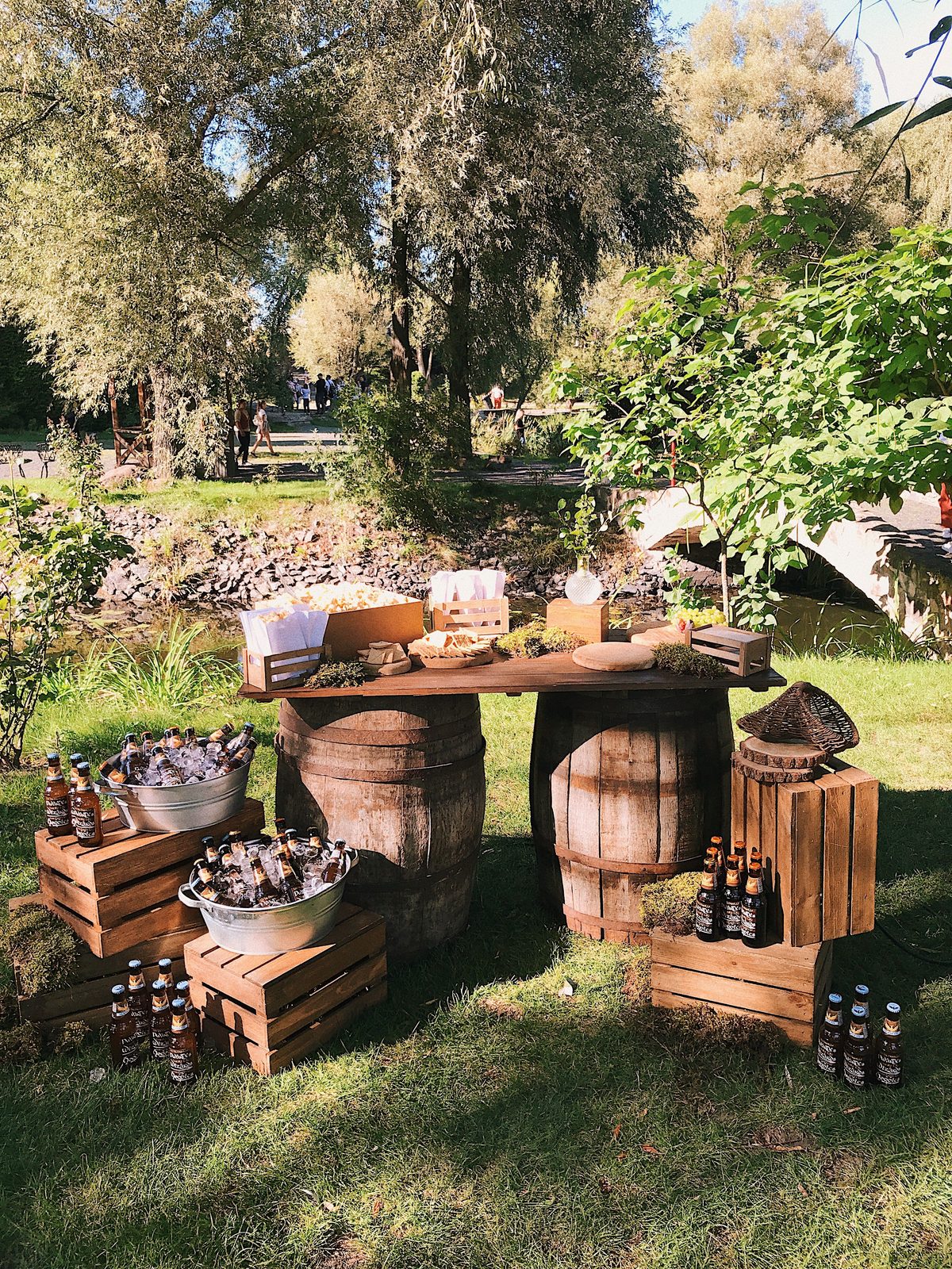 Rustic barrel bar with iced beverages outdoors (stock photo)