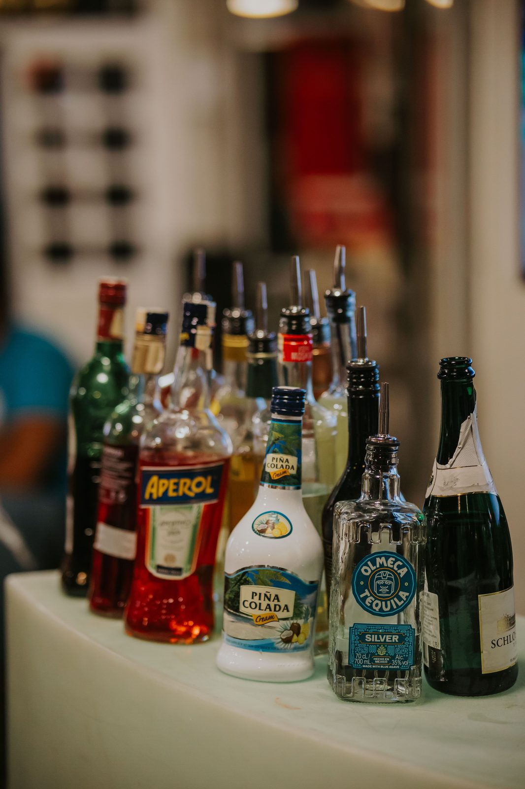 Lineup of bar bottles and mixers (stock photo)