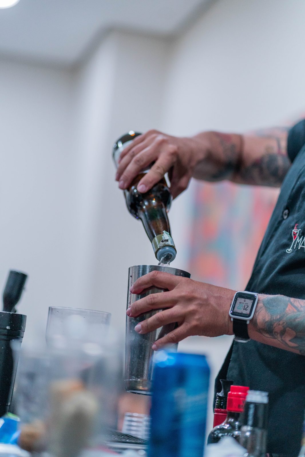 Pouring wine into a cocktail shaker (stock photo)