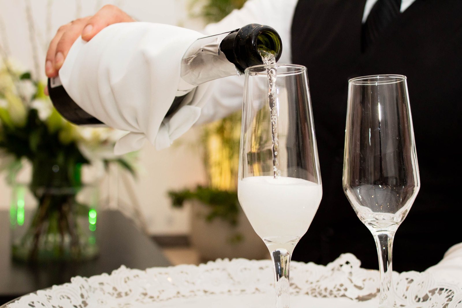 Formal champagne pour for a toast (stock photo)
