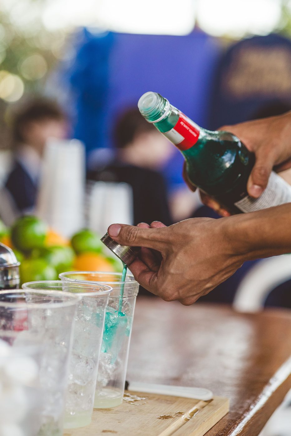 Pouring a colorful specialty cocktail