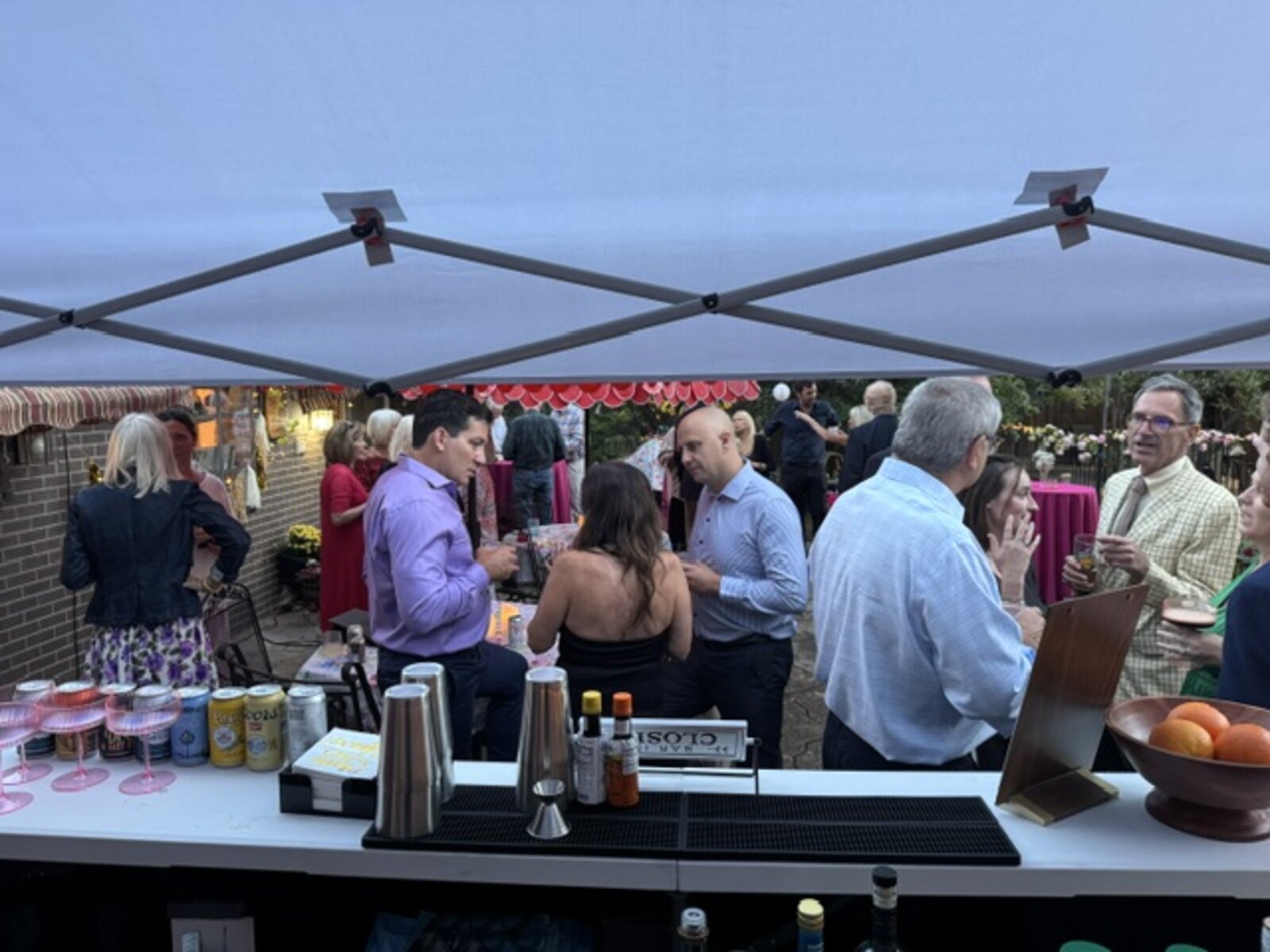 Guests gathered at the bar during an evening private event